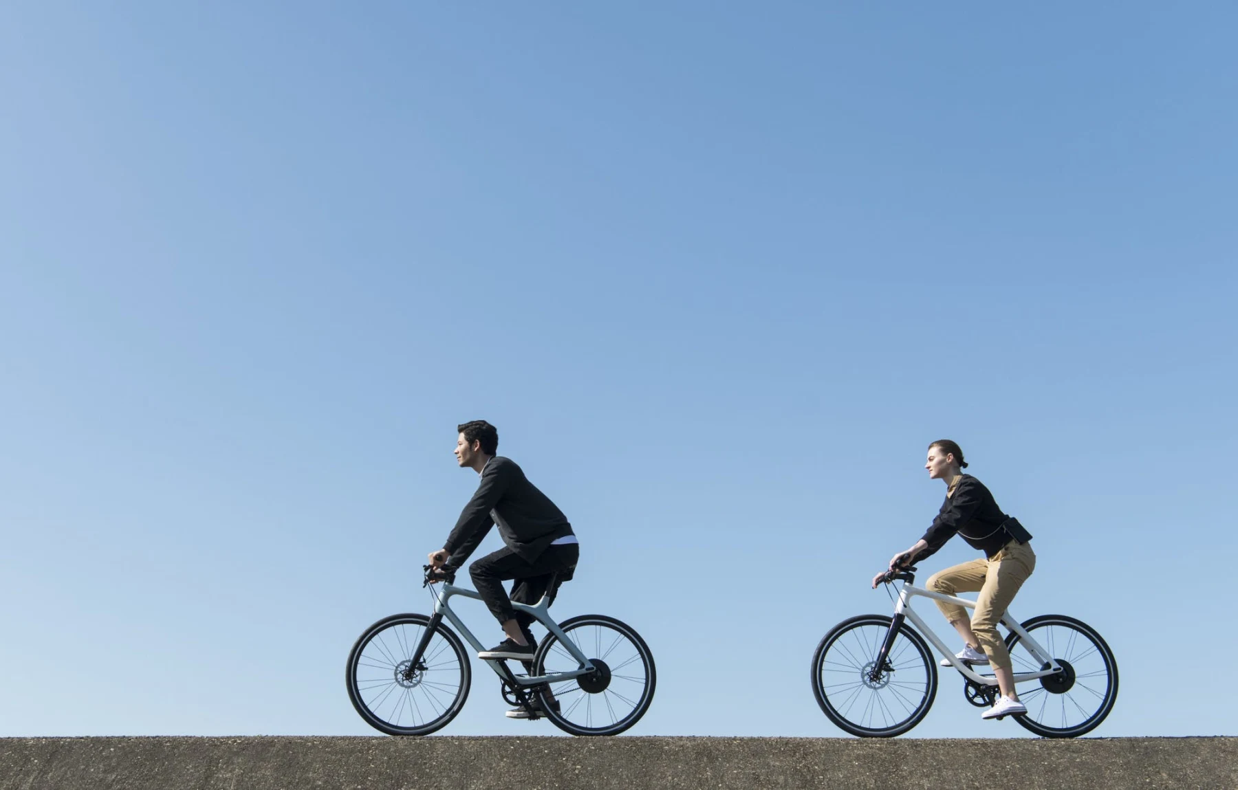 two people riding eeyo electric bikes